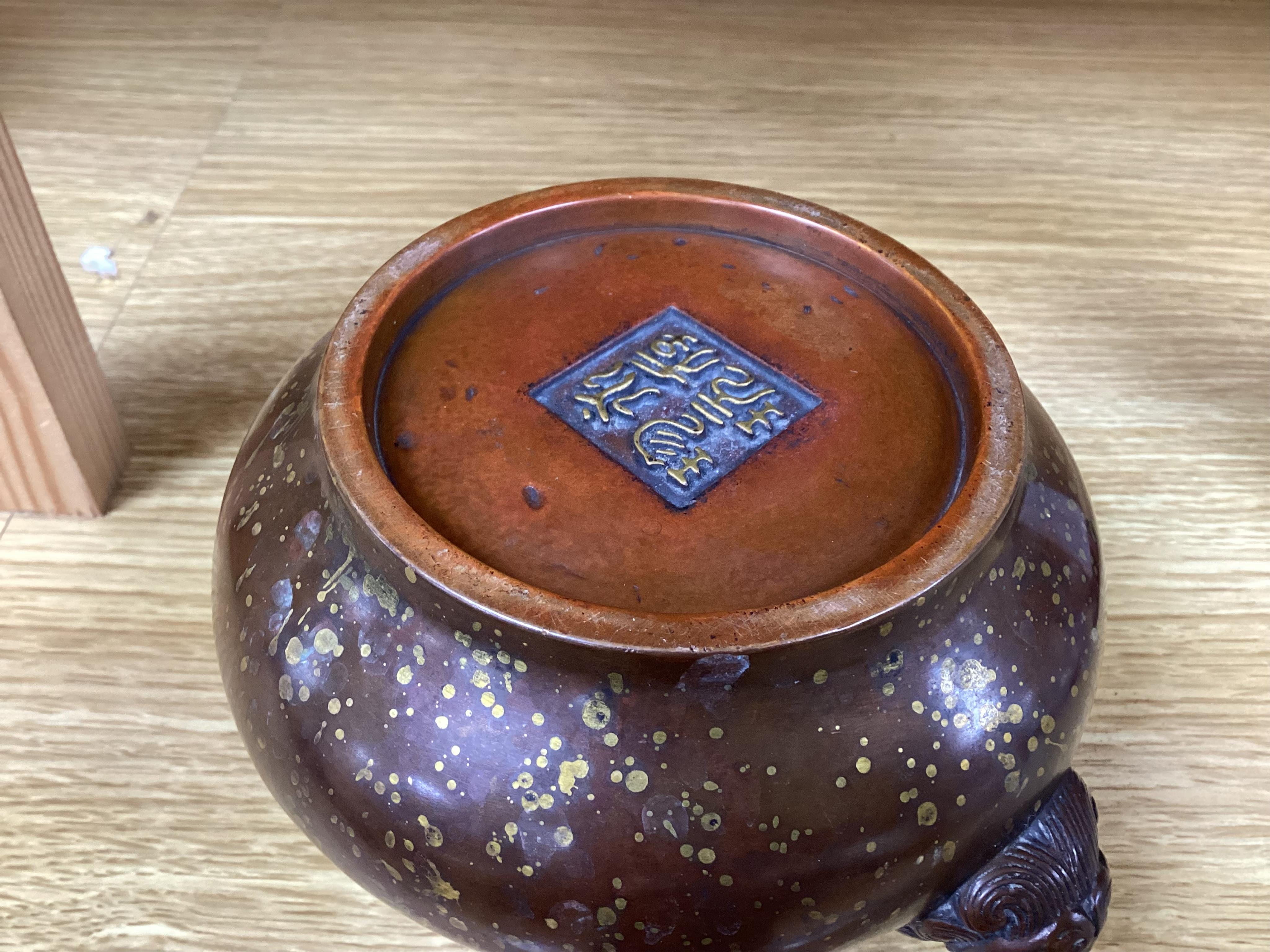 A Chinese gold splashed bronze censer, gui, four character mark, 9cm high. Condition - good